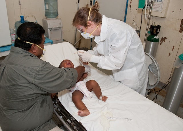 A pediatric patient being treated in a healthcare setup
