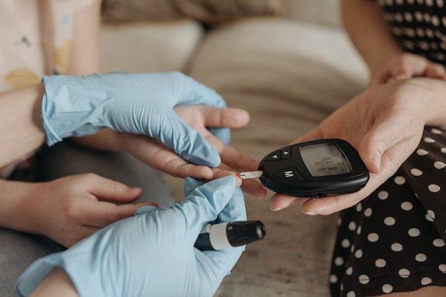 The digital device being employed to check BGL of a diabetic patient