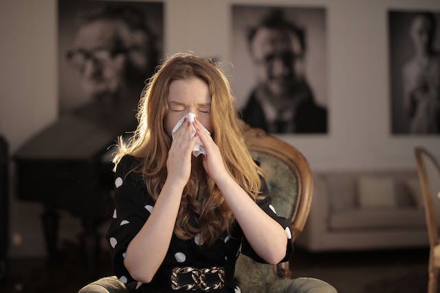 A woman suffering from cold and flu