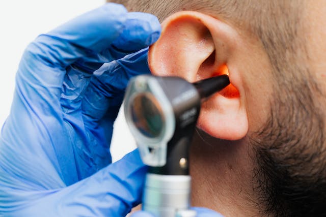 Light from the otoscope illuminates the inner parts of the ear while an examination