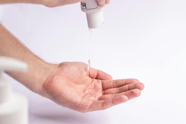 Gel hand sanitizer being used by a consumer