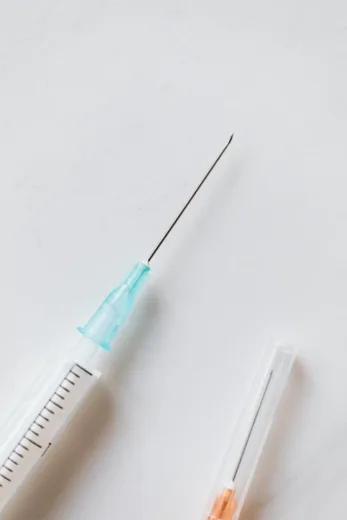 Syringes with needles used in healthcare setups