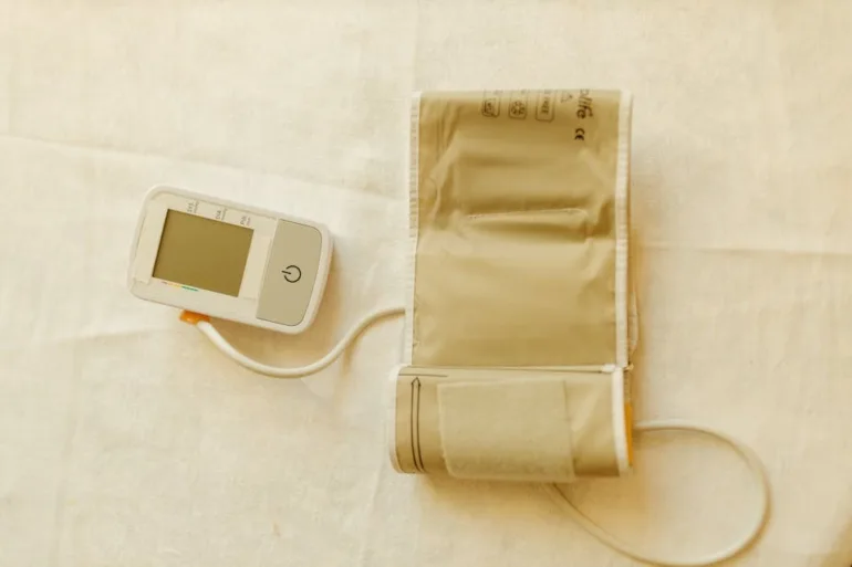 A smart blood pressure monitor with upper arm cuff