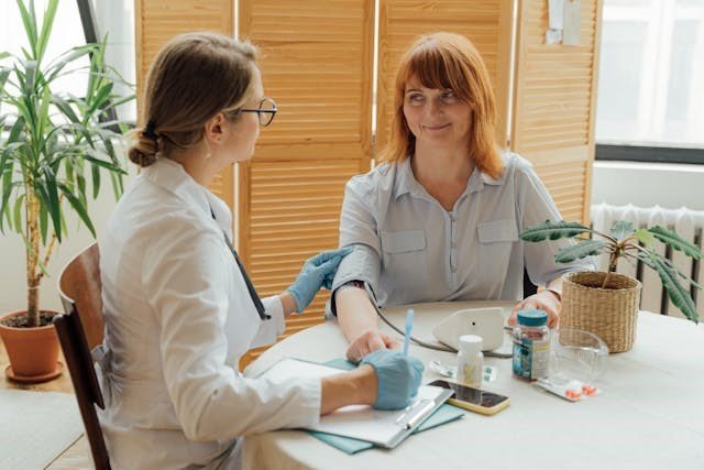 Omron blood pressure readings are being taken using an Omron blood pressure monitor