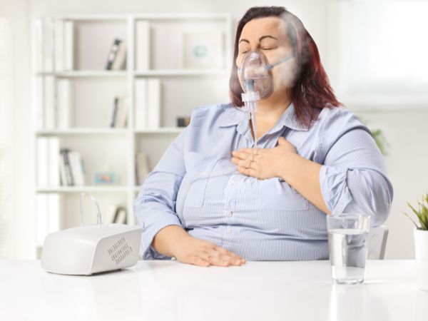 A nebulizer is being used by a respiratory patient as essential medical equipment for chronic respiratory care