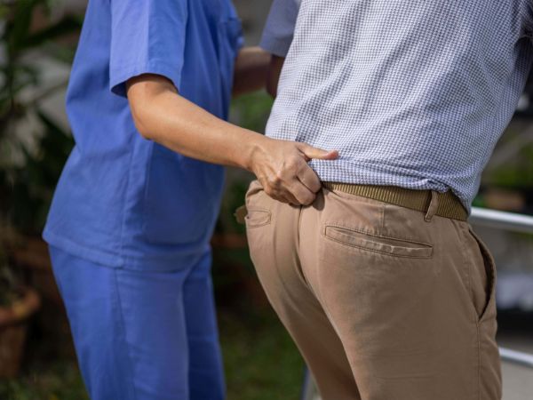 gait belts are hold by the caregivers from the back to support body weight while transferring patients