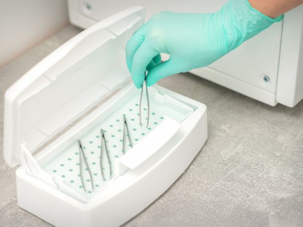 forceps being kept for cleaning in a tweezer stand at a healthcare facility 1