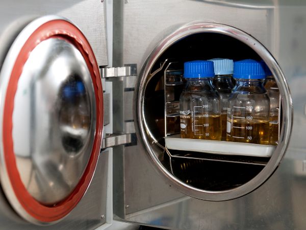 Liquid samples are being sterilized in an autoclave sterilizer