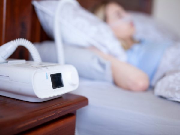 The ResMed AirSense 11 CPAP machine is being used by a patient