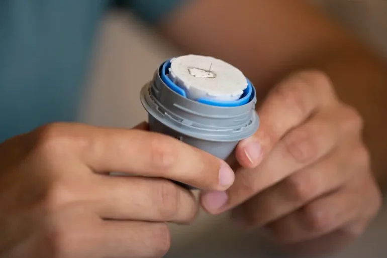 An inserter or applicator is used to place the Medtronic CGM system into the skin